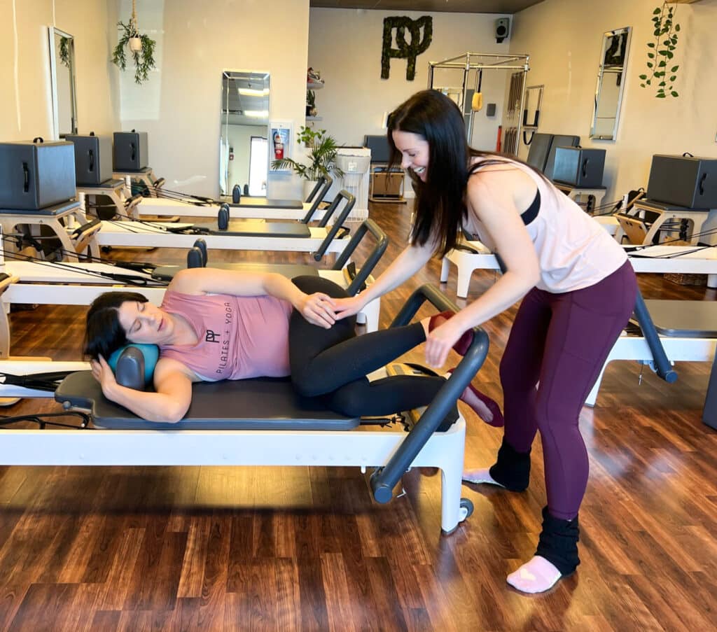 prenatal pilates student practicing pilates on the reformer